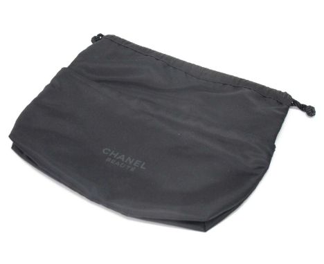 Chanel; A Black Beauté Cosmetic Pouch, given as a complimentary gift, with outer zip pocket and drawstring fastening, 25 x 27