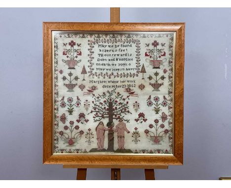 A Mid XIX Century Woolwork Sampler, worked by Margaret White December 23, 1852, with Adam and Eve beside a serpent wrapped ar