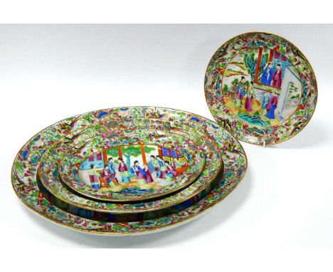 Three Graduated Chinese Famille Rose Pottery Oval Dishes, painted in typical manner with figures on terraces within borders o