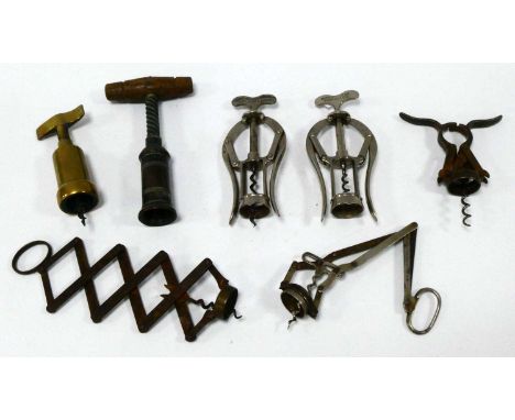 A Thomason Type Corkscrew, with turned wood handle, another brass example, two James Heeley and Sons double lever corkscrews,