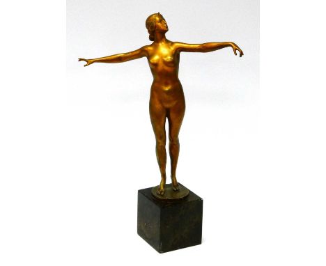 AFTER OTTO SCHMIDT-HOFER (1873-1925): An Art Deco Gilt Metal Sculpture of a Dancer, her arms outstretched, signed, raised on 