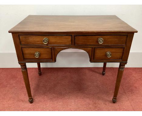 An Early XIX Century Regency Mahogany Kneehole Dressing Table, stamped "Wilkinson Ludgate Hill, No 8021", the four drawers wi