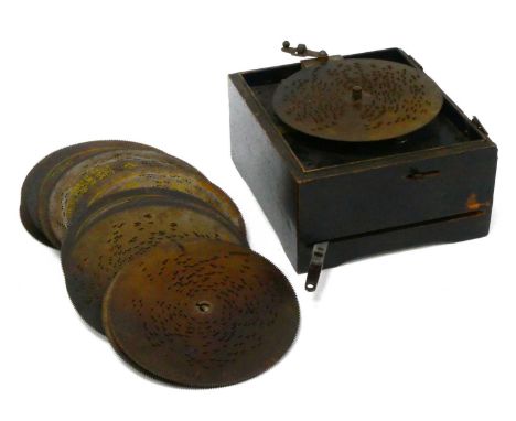 A Late XIX Century Table Top Symphonium, with brass and metal comb, cover missing, together with twenty-two discs.
