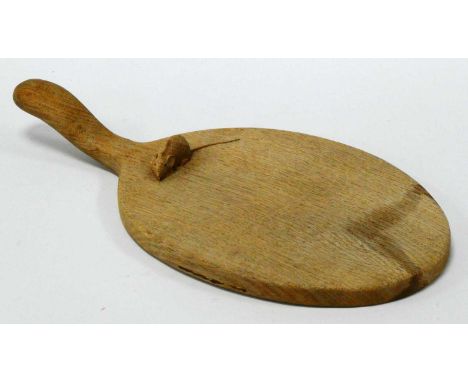 A Robert Thompson 'Mouseman' Oak Cheese Board, of oval form with handle, the mouse unusually carved on the boar rather than t