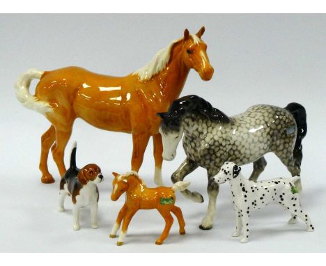 A Beswick Pottery Model of Stocky Jogging Mare, in rocking horse grey, printed marks (cracked), 15cm high; a Beswick Palomino