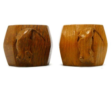 Two Robert Thompson 'Mouseman' Oak Napkin Rings, with carved mouse signature, 5cm diameter. (2)5cm high - they are different 