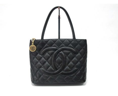 Chanel; A Timeless Medallion Tote Bag, in black caviar leather with classic logo within quilting, rolled leather handles, zip