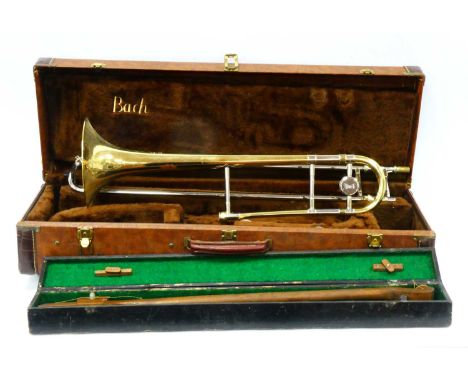An American Bach 'Stradivarius' Model 36 Trombone, cased and a home-made stringed instrument. (2)