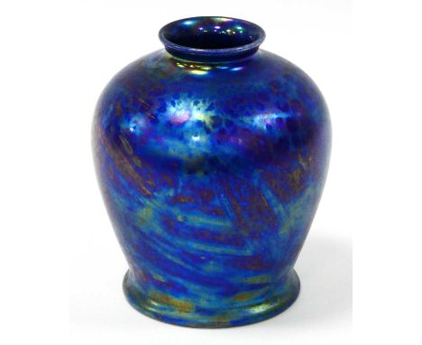 A Ruskin Pottery Vase, of ovoid form decorated with petrol kingfisher blue mottled lustre glaze, impressed marks, 15cm high.L