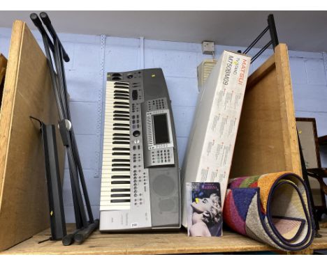 A Technics SX-KN6000 keyboard and a modern abstract rug