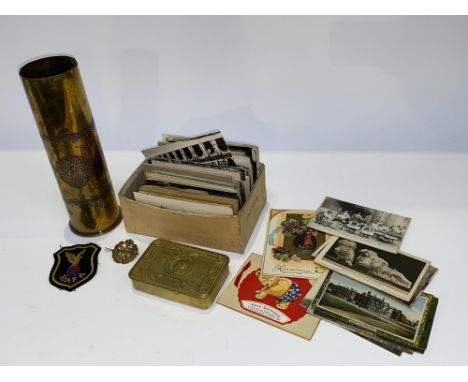 A brass Trench Art cylindrical vase with Eastern design, 28cm H, a World War One Christmas tin and a box of early 20th Centur