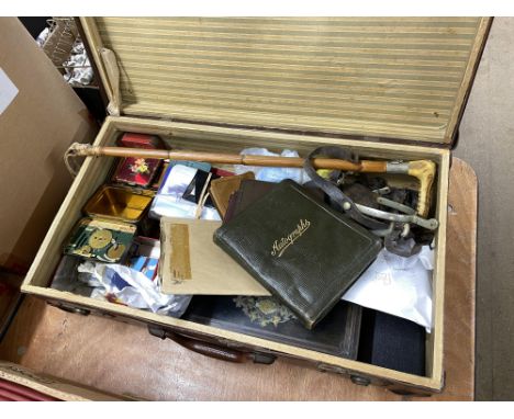 Suitcase containing postcards, tins, autograph books and a horse whip