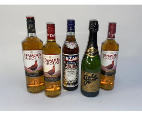 Three bottles of The Famous Grouse Scotch whisky, a bottle of Cinzano Vermouth and Gala sparkling wine