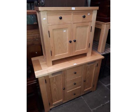 A light oak sideboard and a light oak side cabinet. 