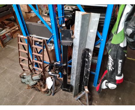 Various tools and garage items including car ramps, pick axe, engineers vice etc. 
