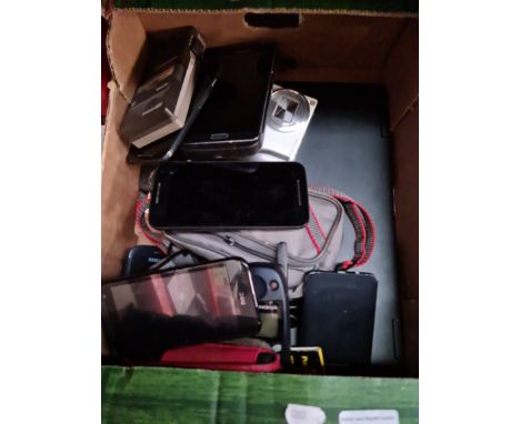 A box of mobile phones to include Samsung, HTC, Philips pocket memo recorder, a HP laptop, etc. 