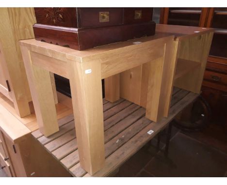 A pair of light oak side tables. 