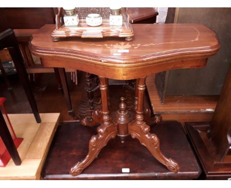 A reproduction inlaid mahogany fold top card table. 