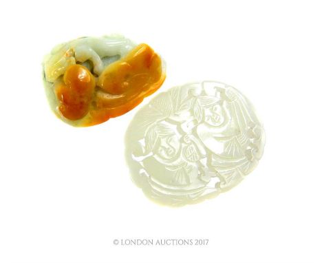 A Chinese carved jade pendant with another carved item (2)