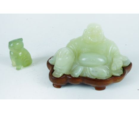 Two, Chinese green jade figurines to include a seated Buddha on an original fitted hardwood stand, Dimensions of figure and s