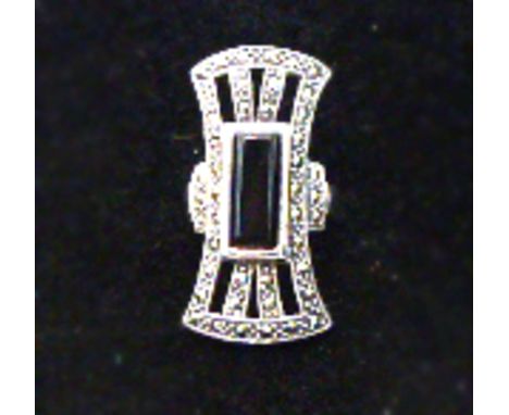 An Art Deco style silver and onyx ring.