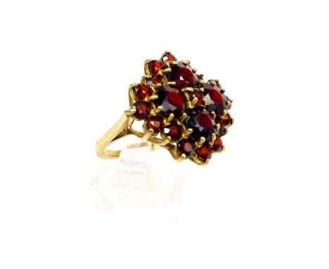 A stunning, vintage, large, 9 ct yellow gold and garnet, cluster cocktail ring, composed of four, large, round, faceted garne