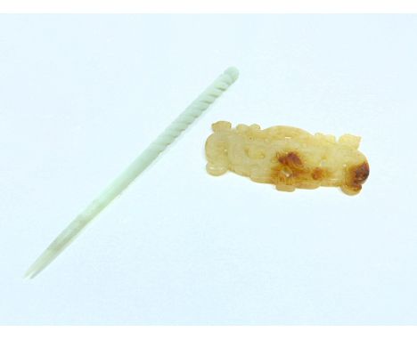 A Chinese jade pendant (9cm long) together with a jade hair pin (8cm long). (2)