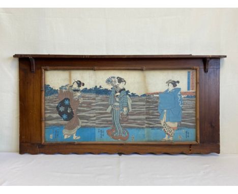 A 19th century wall mounted hardwood and bamboo shelf with a glazed panel displaying a triptych of signed Japanese possibly E