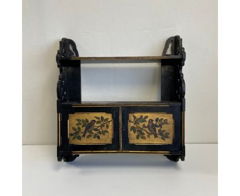 A 19th century Aesthetic Movement black lacquered Chinoiserie wall cabinet having an open top shelf with a bevelled gilt edge