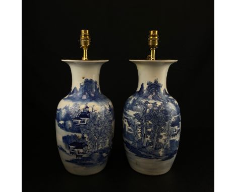 A pair of Chinese Republic period hand painted blue and white porcelain baluster vases mounted with brass lamp fittings (with