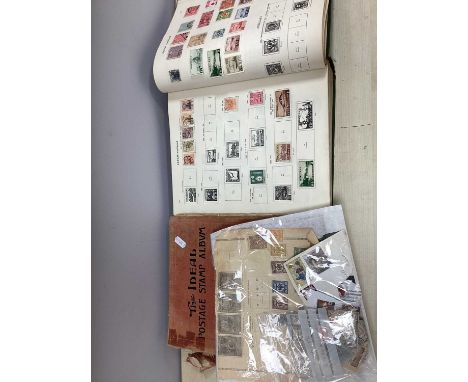 Stamps: A World Stamp Collection, early to 1936, housed in a 'New Ideal' album. also includes a virtually empty 'Ideal' album