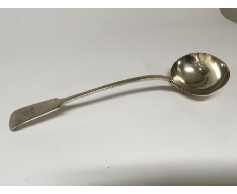 A William IV Silver serving ladle of large size London 1836 hallmarks. Weight 314g length 35cm approx.