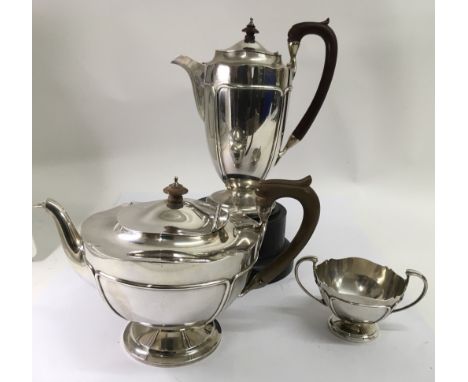 A fine, Mappin and Webb Birmingham  silver three piece teaset, comprising tea and coffee pot and a sucrier, each with shaped 