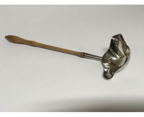 A Silver toddy ladle with a turned wood handle London hallmarks 1972. No damage or dents. No inscription. Length 29cm