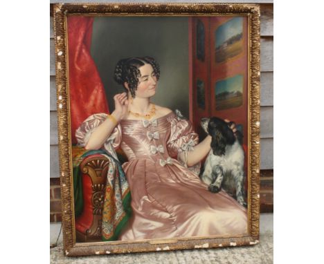 An early 19th Century oil on canvas, portrait of Teresa Arneman of Rolston with a spaniel, 42 1/2" x 33 1/2", in gilt frame (