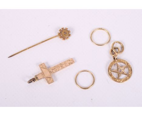 An 18ct gold charm, 3g, a 9ct gold crucifix, a 9ct gold stick pin and a pair of yellow metal hoop earrings