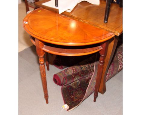 A yew half round hall table, fitted open shelf, on turned and reeded supports, 30" wide, and a mahogany bedside chest, fitted