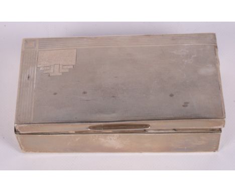 Two engine turned silver cigarette boxes and a larger cigarette box with presentation inscription