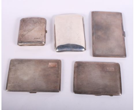 Five silver cigarette cases, three with engine turned decoration, 25.1oz troy approx