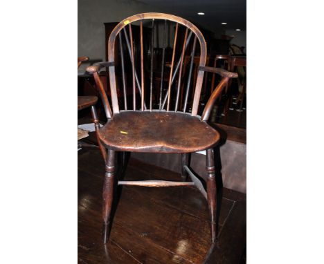 A 19th Century ash, burr elm and fruitwood Windsor stick back elbow chair (replacement spindles)