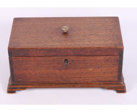 A late Georgian mahogany three-division tea caddy, on bracket supports, 10" wide