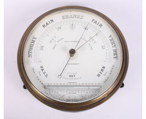 A brass cased aneroid barometer and thermometer by W & H Trimnell, 9" dia