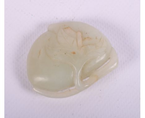 A Chinese pale celadon green jade carving of a peach, 2" wide