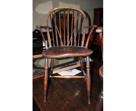 A 19th Century ash, elm and fruitwood Windsor stick back elbow chair, on turned and stretchered supports