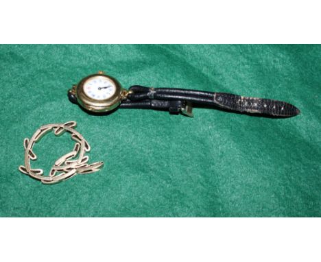 A lady's 18ct gold cased wristwatch with white enamel dial and Arabic numerals together with an associated 18ct gold watch br