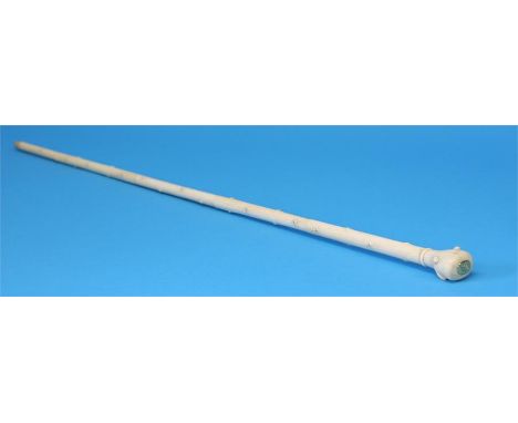 A late 19th / early 20th century ivory sectional walking cane, carved to imitate a hawthorn branch and inset with ebony, the 