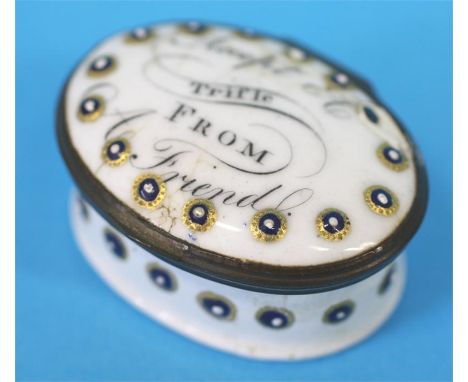 A 19th century oval enamelled trinket box, 'Accept a trifle from a friend'.  5 cm long
