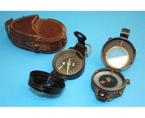 A World War I military compass by T Cooke & Sons Ltd, number 64779, dated 1917 with leather case; and a Bakelite Engineer dir