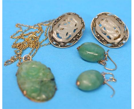A pair of white metal white carved jade clip on earrings, a carved jade pendant and a pair of jade earrings.