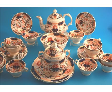 A Victorian tea set comprising teapot, sucrier, slop bowl, 2 cake plates, 12 cups and saucers.